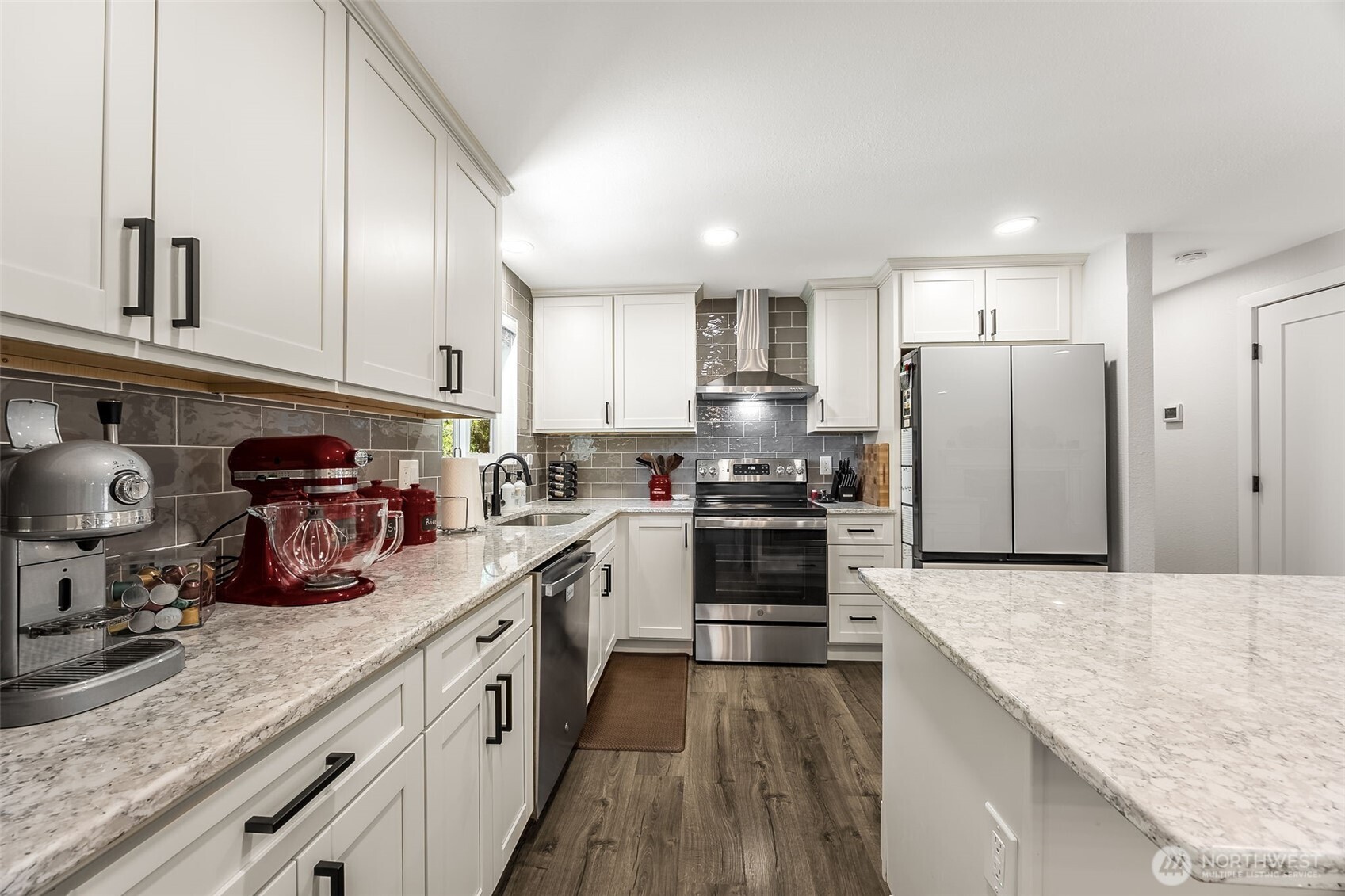 24028 6th Place West Bothell, WA 98021 - Photo 15 of 35 a kitchen with refrigerator a stove and cabinets
