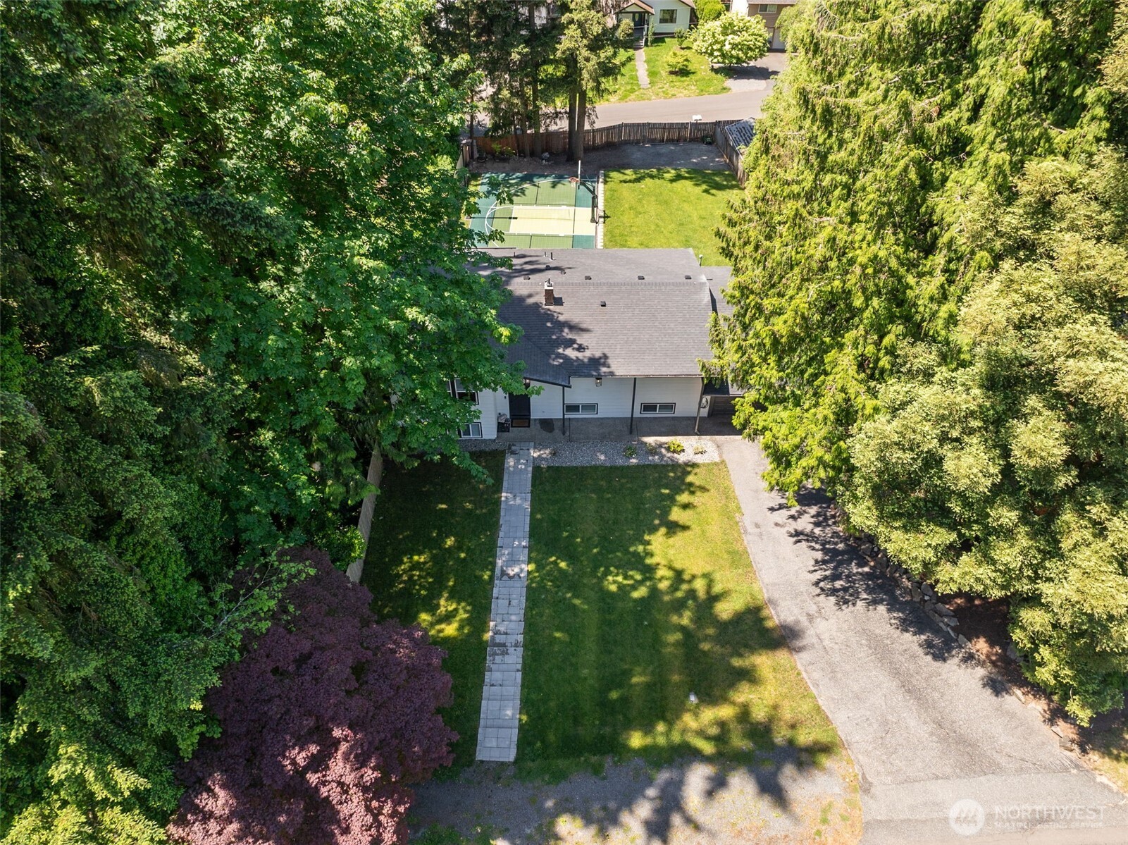 24028 6th Place West Bothell, WA 98021 - Photo 2 of 35 a view of a yard with plants