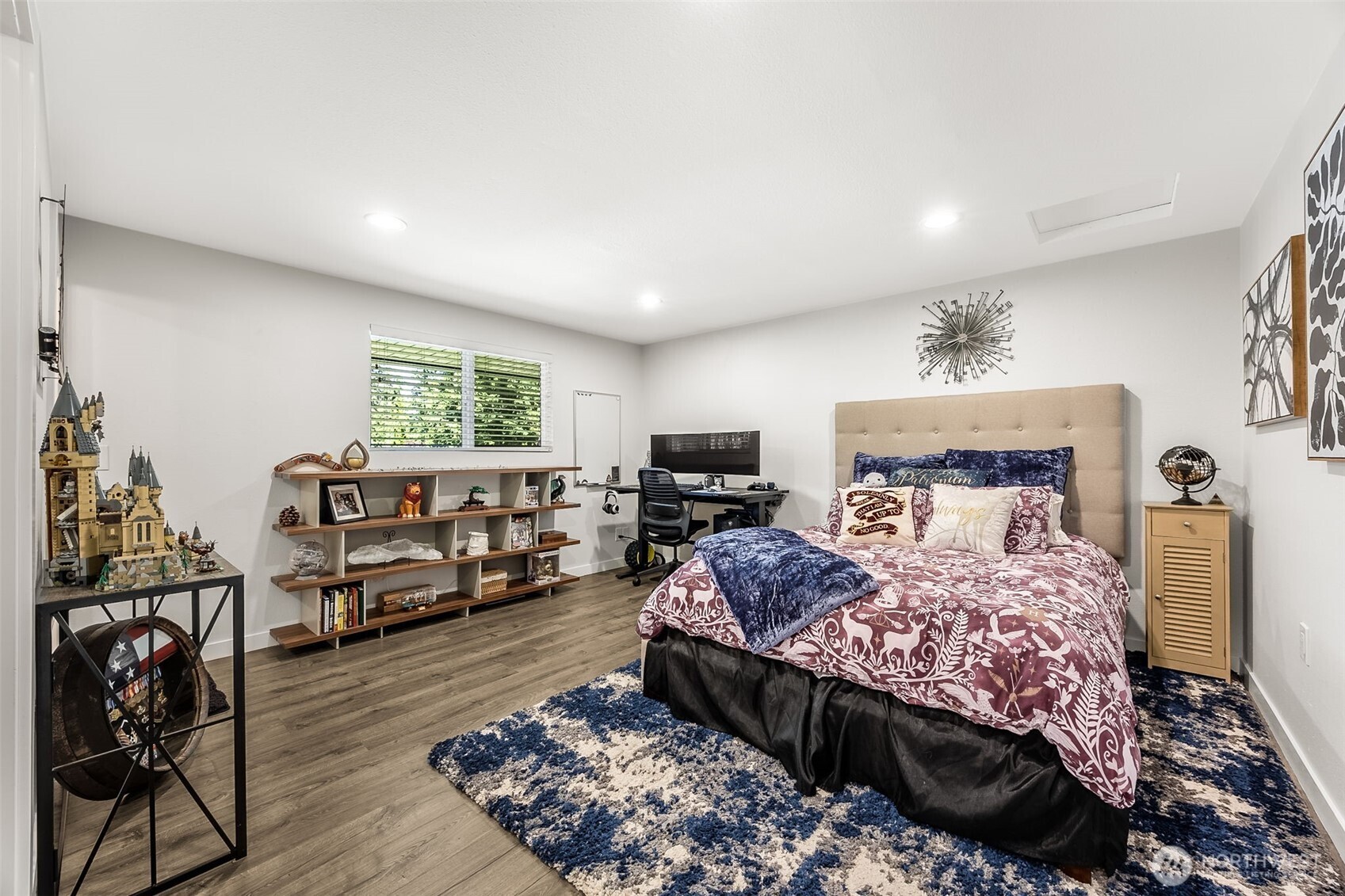 24028 6th Place West Bothell, WA 98021 - Photo 23 of 35 a bedroom with a bed and wooden floor