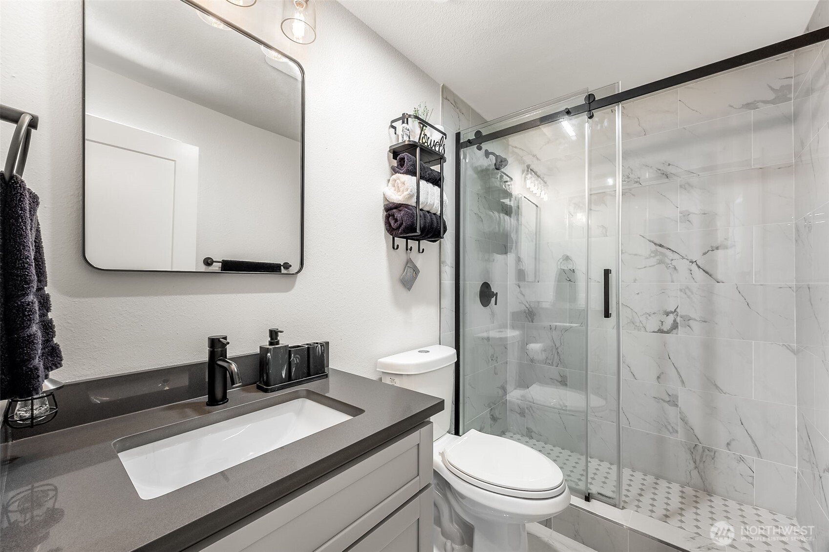 24028 6th Place West Bothell, WA 98021 - Photo 25 of 35 a bathroom with a sink a toilet and shower