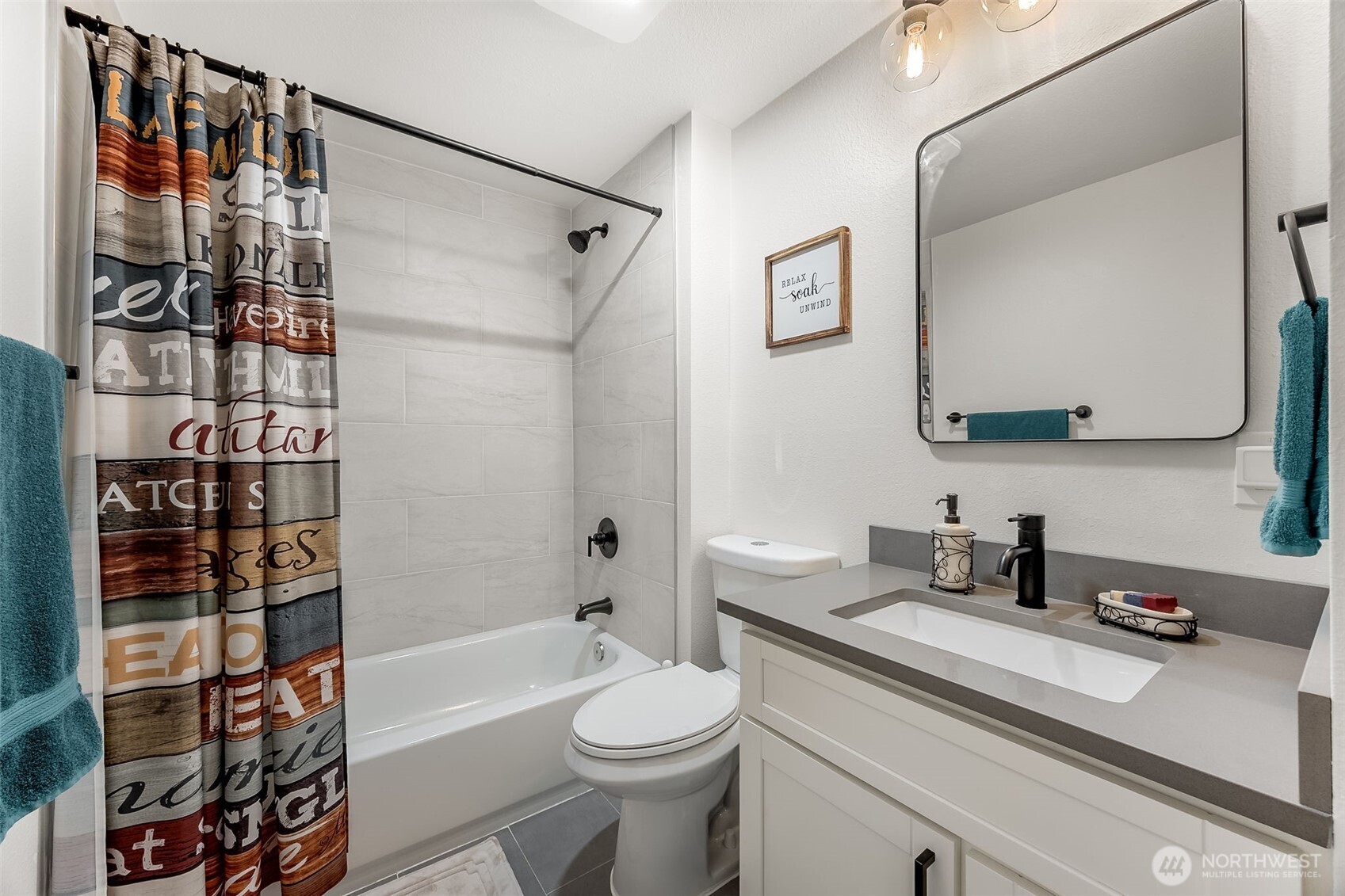 24028 6th Place West Bothell, WA 98021 - Photo 26 of 35 a bathroom with a sink a toilet and shower