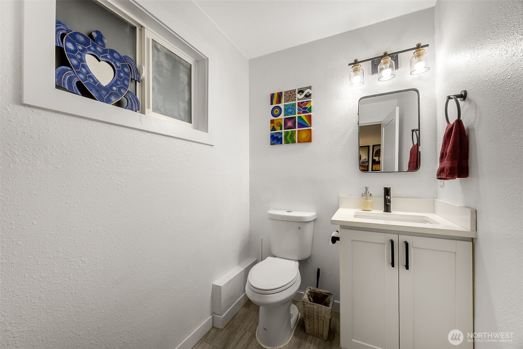24028 6th Place West Bothell, WA 98021 - Photo 28 of 35 a bathroom with a toilet sink and mirror