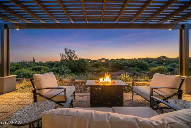 a view of a lake with outdoor seating