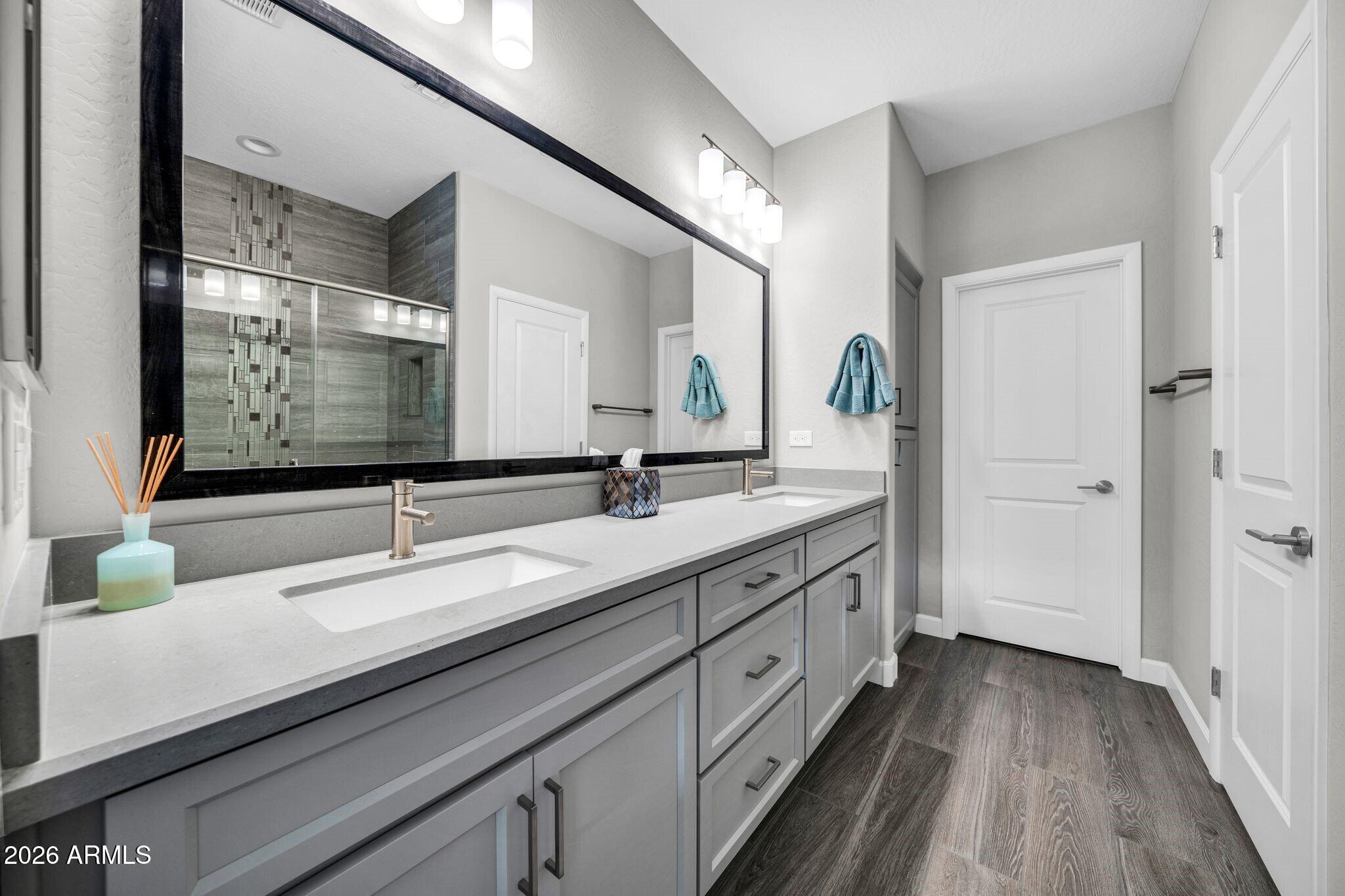 17501 East Cindercone Road Rio Verde, AZ 85263 - Photo 13 of 43 a spacious bathroom with a double vanity sink and mirror