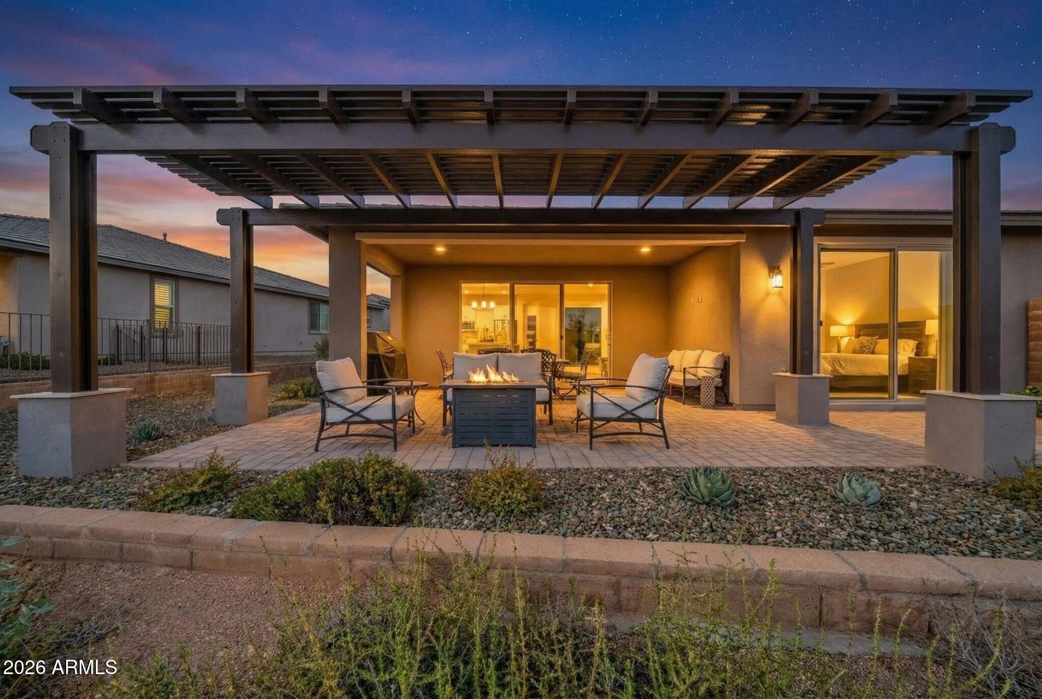 17501 East Cindercone Road Rio Verde, AZ 85263 - Photo 2 of 43 a view of a porch with furniture and floor to ceiling window
