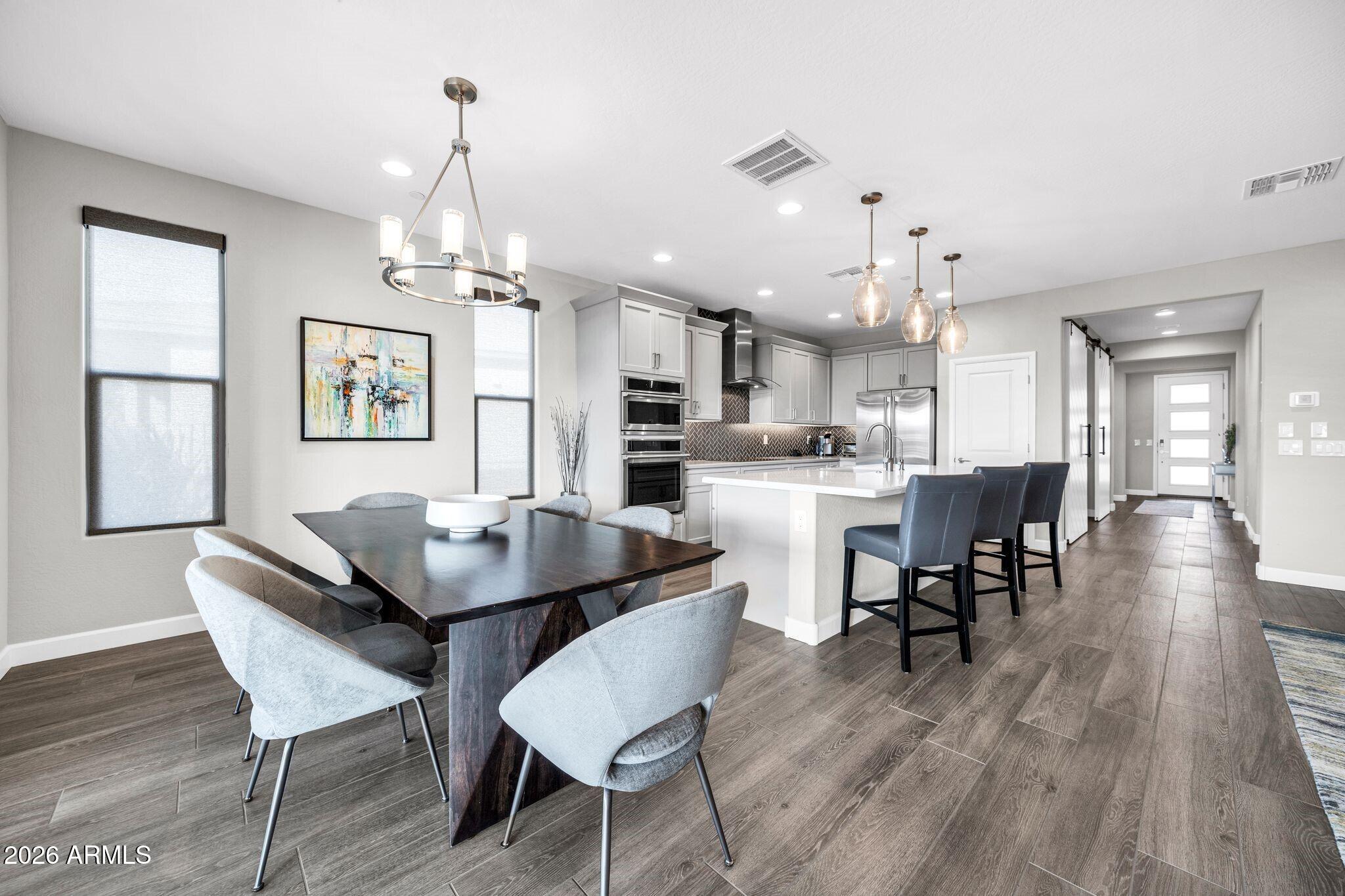 17501 East Cindercone Road Rio Verde, AZ 85263 - Photo 4 of 43 a view of a dining room with furniture and wooden floor