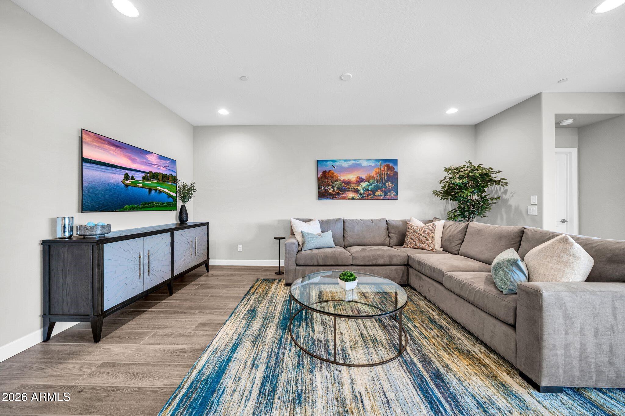 17501 East Cindercone Road Rio Verde, AZ 85263 - Photo 9 of 43 a living room with furniture and a flat screen tv