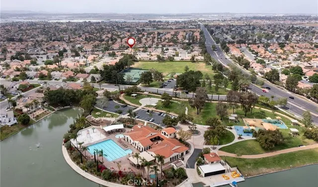 an aerial view of a house with a lake view