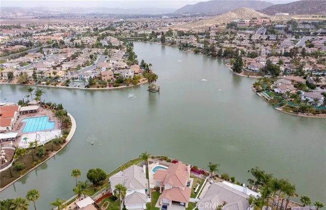 an aerial view of a house with a lake view