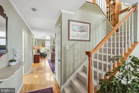 a view of a livingroom with furniture and stairs