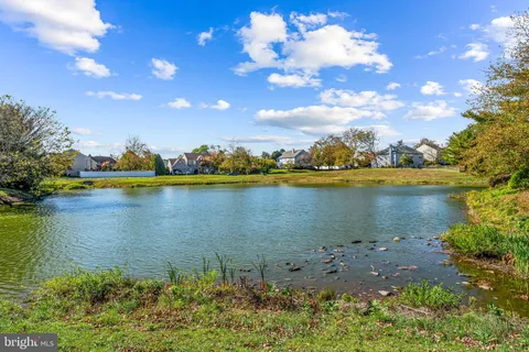 a view of a table and chairs in patio with wooden fence