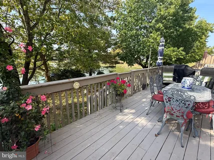a view of a balcony with wooden floor