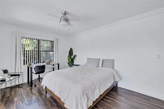 a living room with furniture wooden floor and a flat screen tv