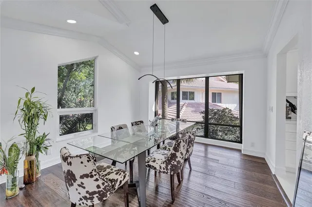 a view of entryway with wooden floor and a front door