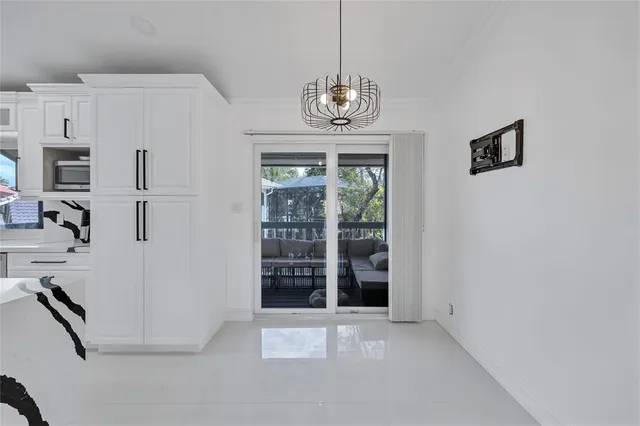a bedroom with a large bed and a large window