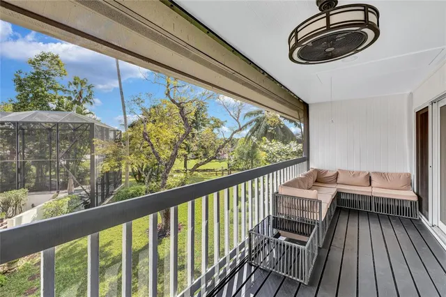 a spacious bedroom with a bed and wooden floor