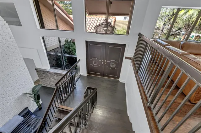 a kitchen with cabinets and wooden floor