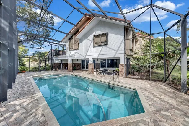 a view of a swimming pool with a patio