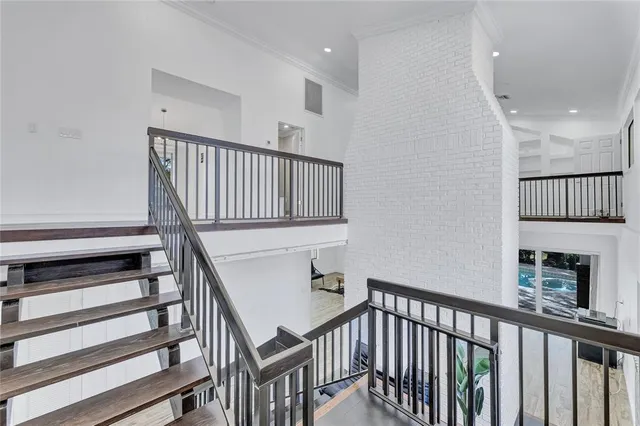 a bathroom with a double vanity sink a toilet a mirror and shower