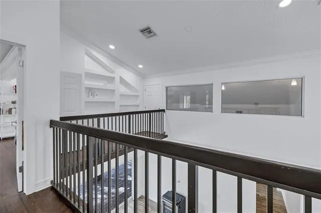 a bathroom with a double vanity sink a toilet and shower