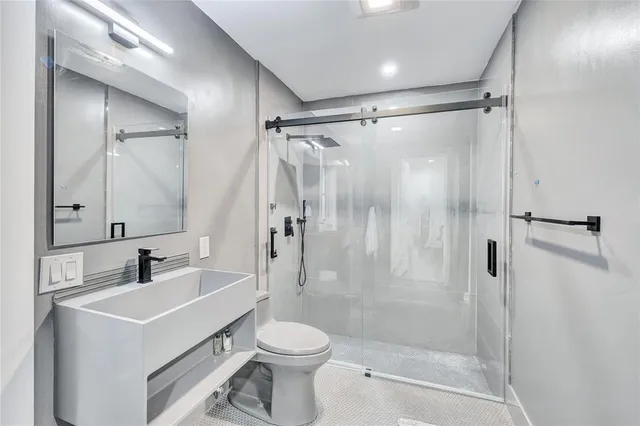 a view of a kitchen with wooden floor and a sink