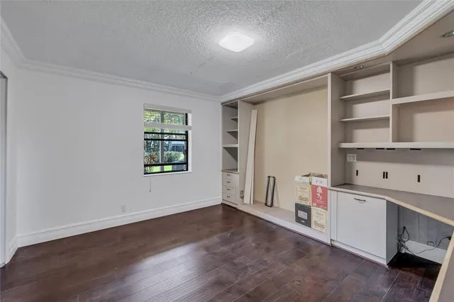 an aerial view of residential house with outdoor space and trees all around
