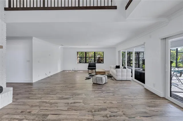 a view of living room with furniture and window