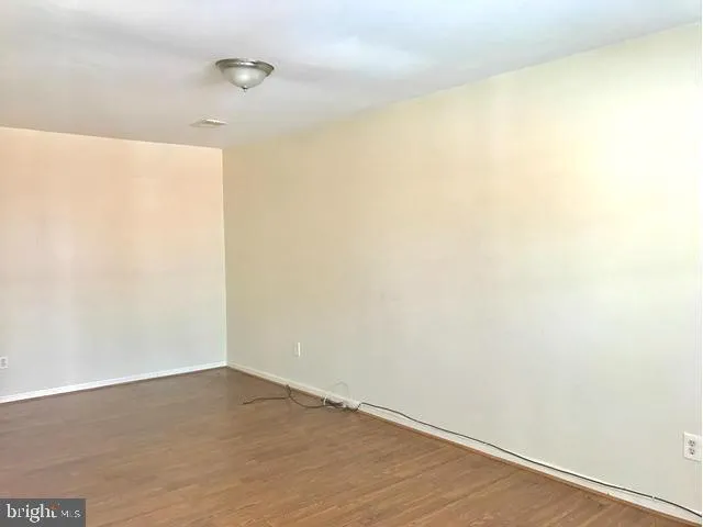 a view of staircase with white walls