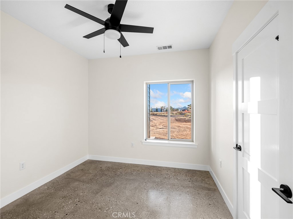 16173 Pela Road Apple Valley, CA 92307 - Photo 11 of 36 a view of an empty room with a window