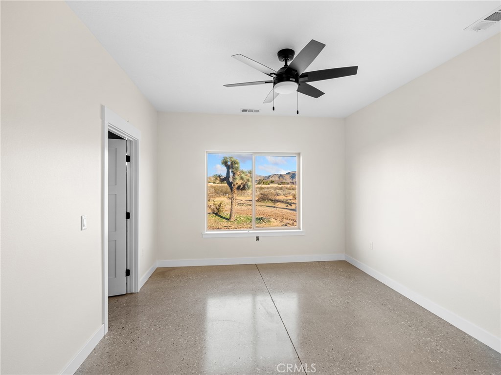 16173 Pela Road Apple Valley, CA 92307 - Photo 16 of 36 a view of an empty room with a window