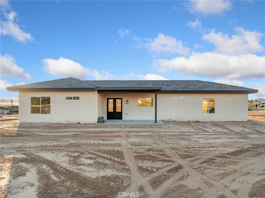 16173 Pela Road Apple Valley, CA 92307 - Photo 24 of 36 a view of a house with a patio