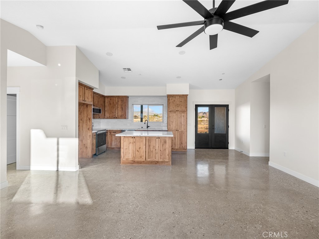 16173 Pela Road Apple Valley, CA 92307 - Photo 4 of 36 a large kitchen with cabinets and stainless steel appliances