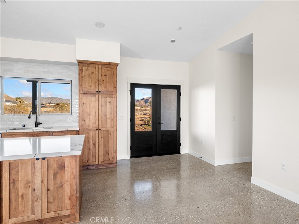 16173 Pela Road Apple Valley, CA 92307 - Photo 9 of 36 a view of an empty room with a window