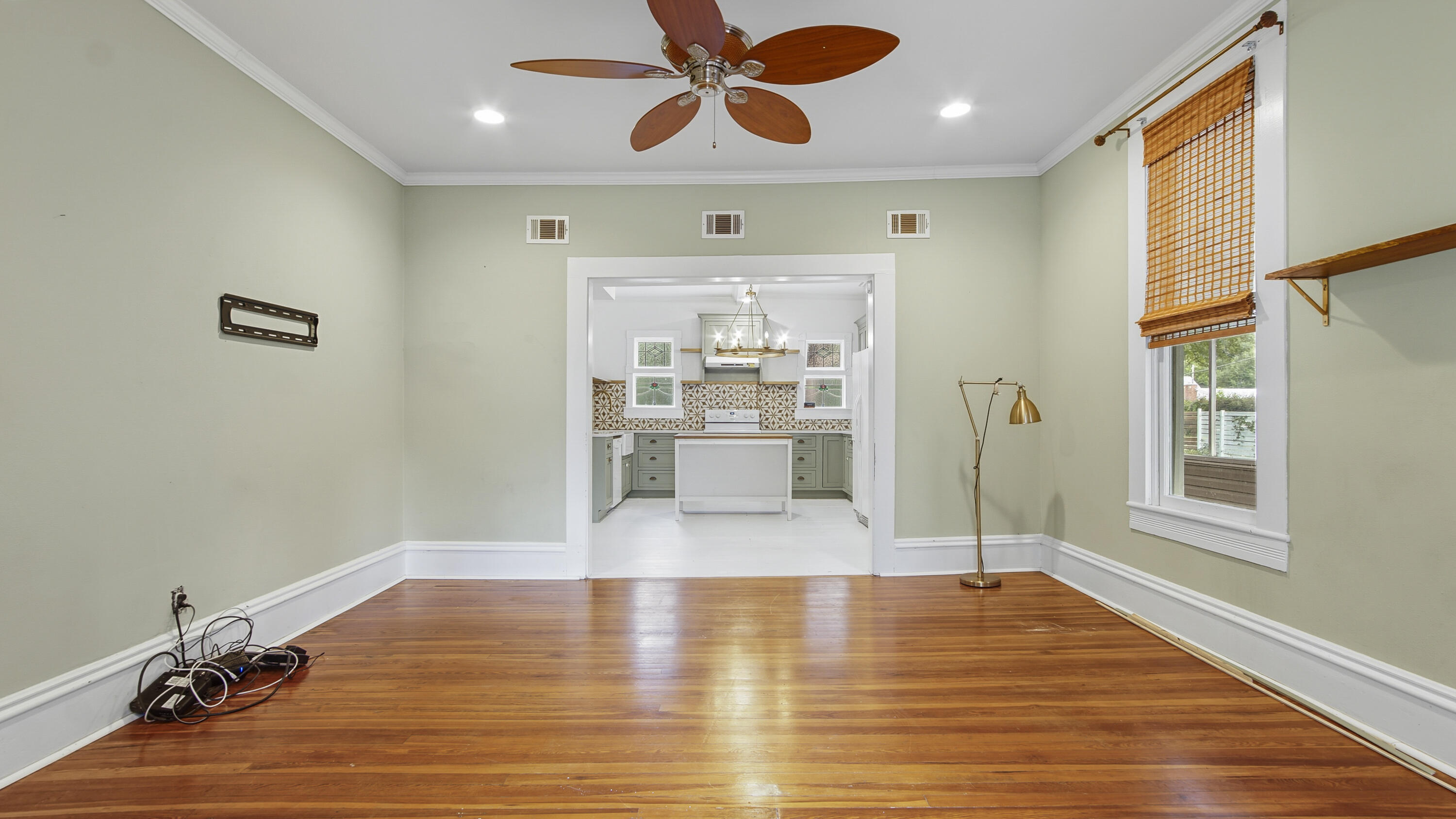 87 Bay Avenue DeFuniak Springs, FL 32435 - Photo 11 of 55 a view of a room with wooden floor and windows