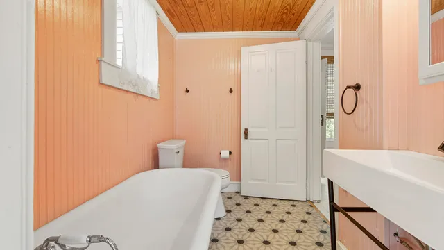 a bathroom with a bathtub and shower