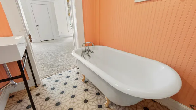 a bathroom with a bathtub and shower