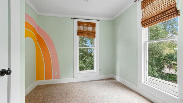 a view of a room that has a large window