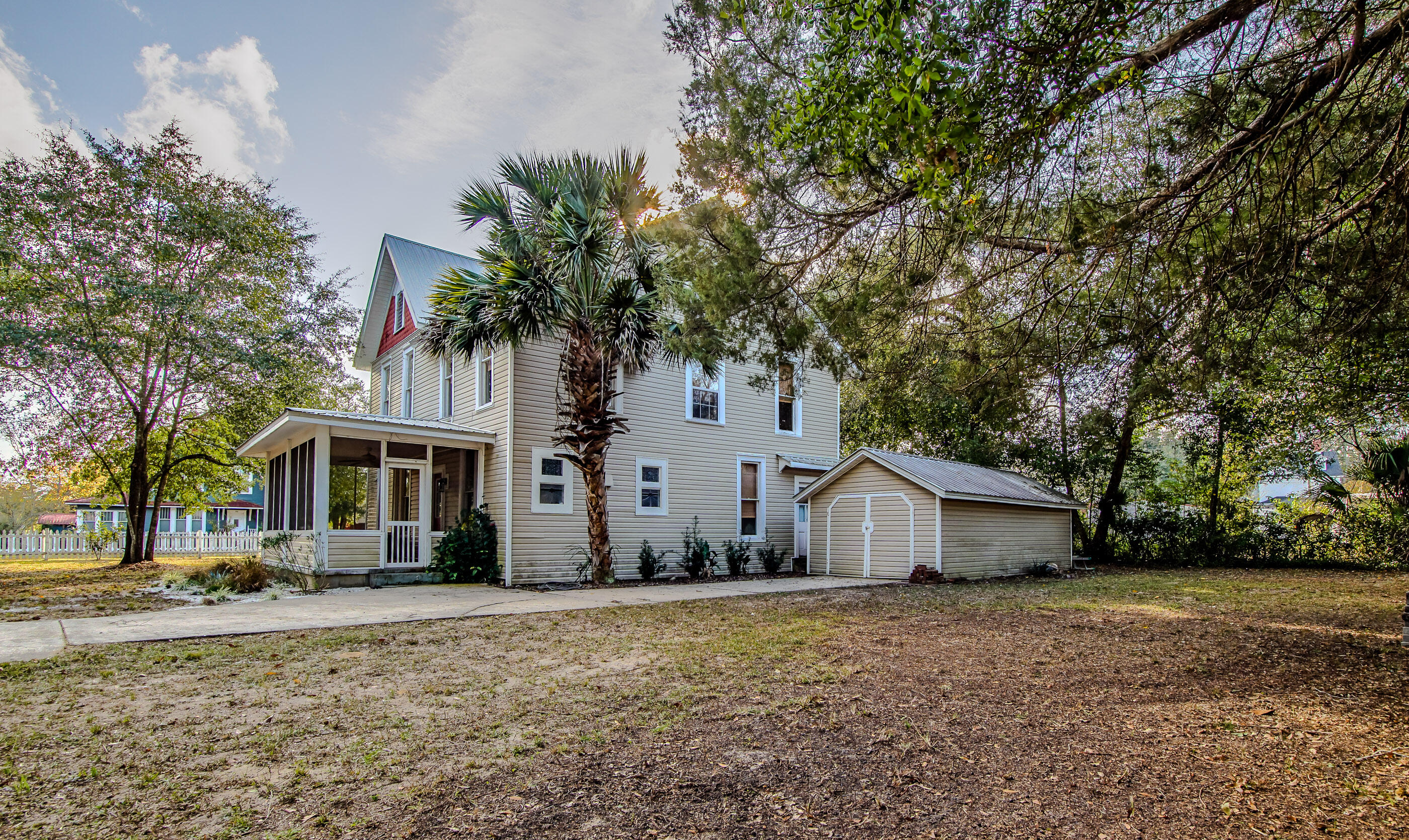 87 Bay Avenue DeFuniak Springs, FL 32435 - Photo 42 of 55 a view of house with outdoor space and tree in the background