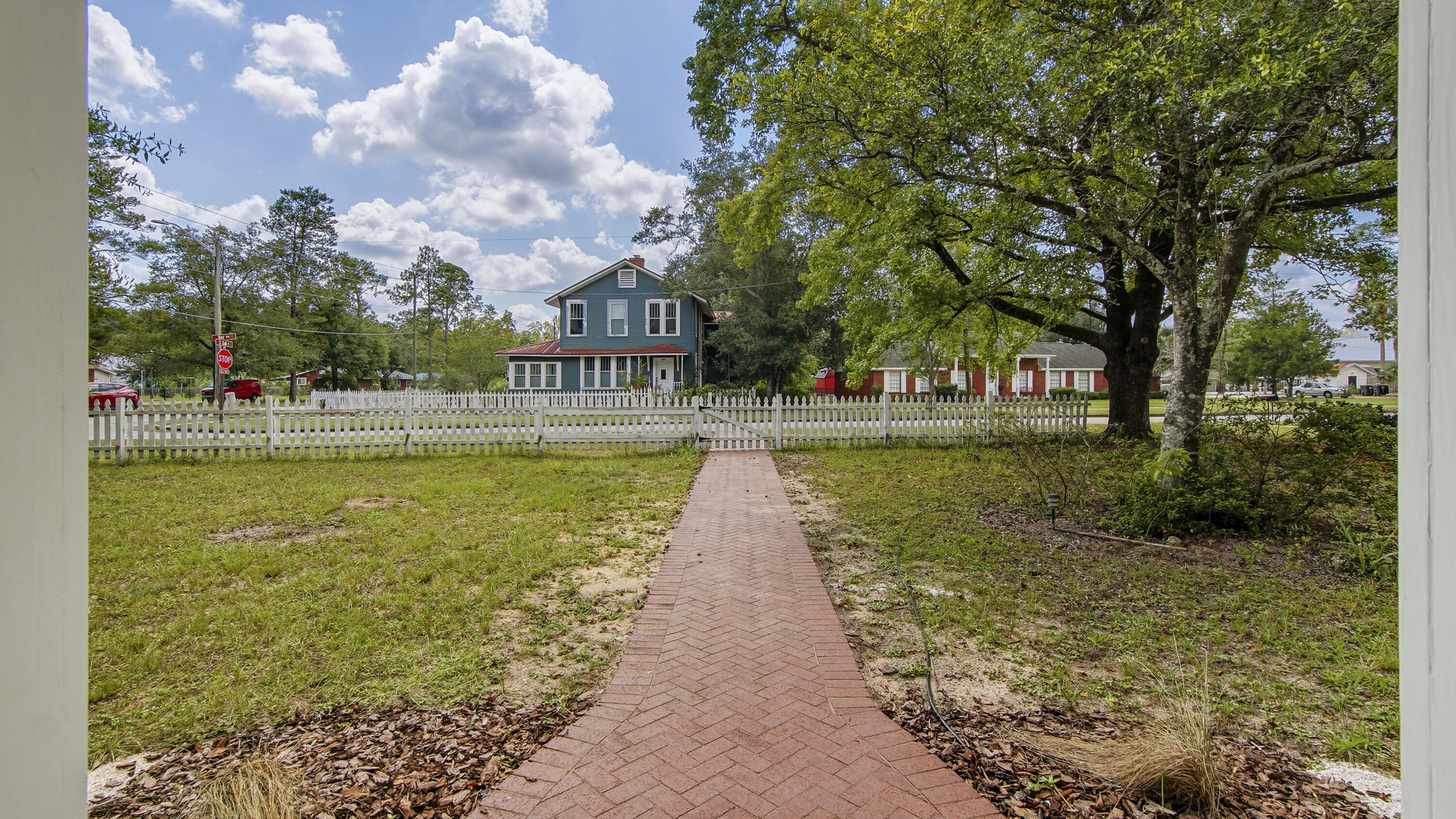 87 Bay Avenue DeFuniak Springs, FL 32435 - Photo 45 of 55 a view of a lake with a building in the background
