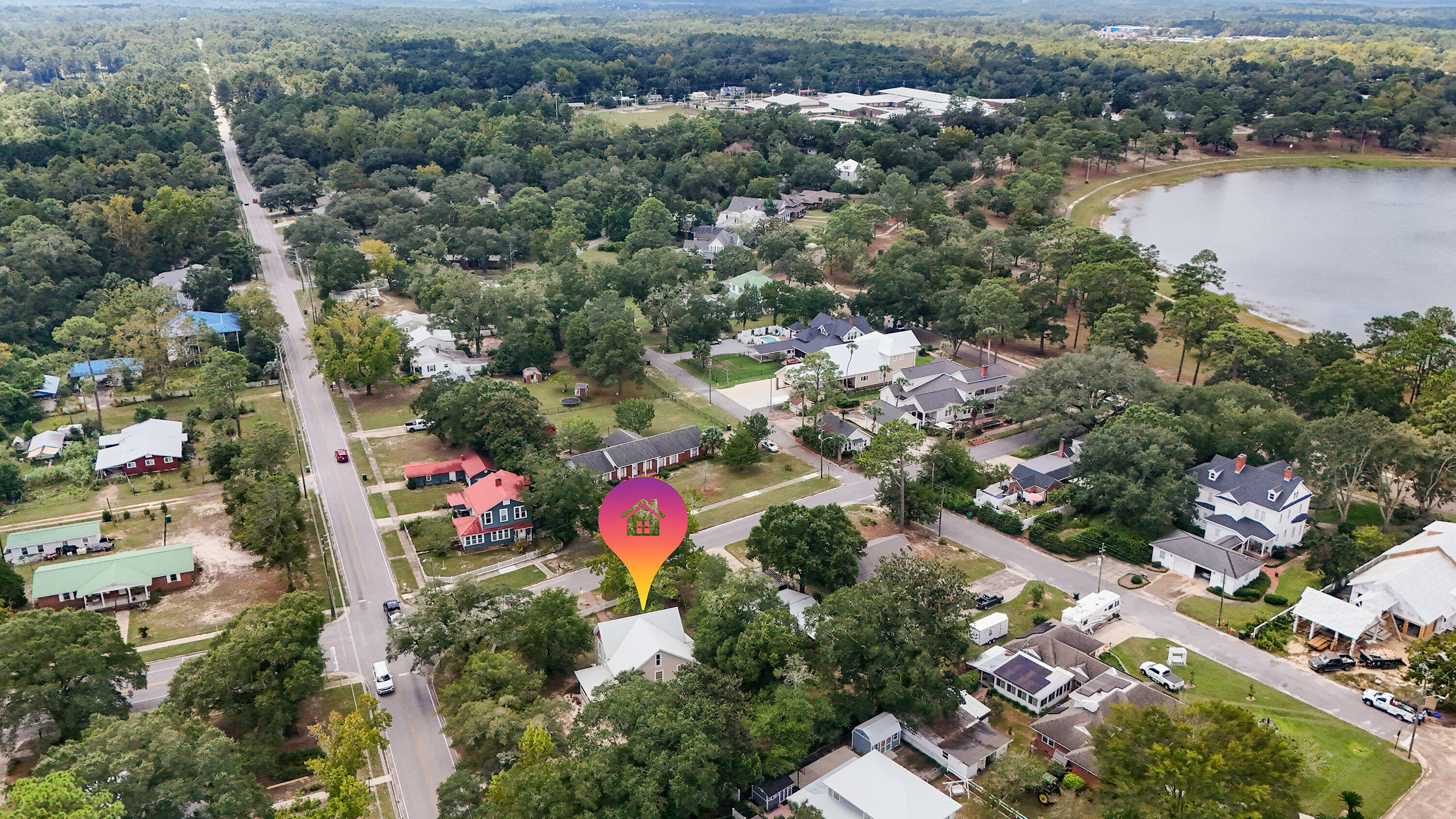 87 Bay Avenue DeFuniak Springs, FL 32435 - Photo 50 of 55 an aerial view of residential house with outdoor space and lake view