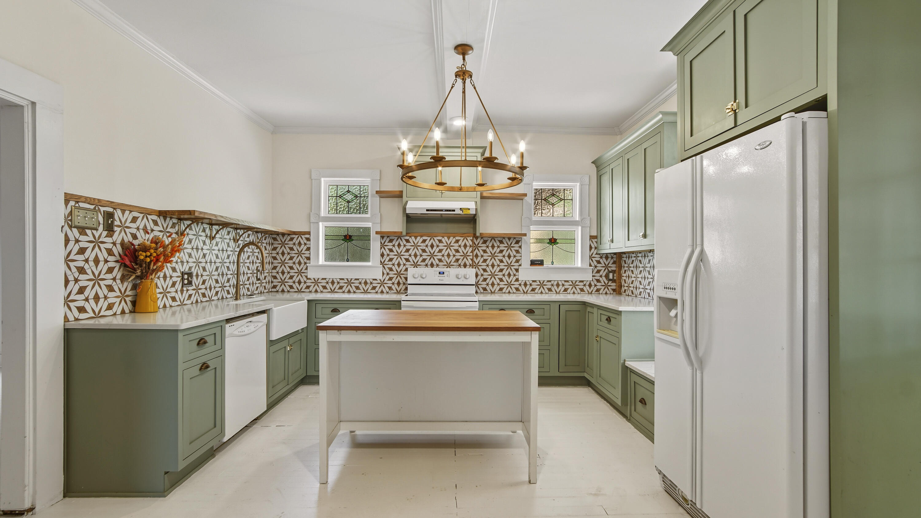 87 Bay Avenue DeFuniak Springs, FL 32435 - Photo 5 of 55 a kitchen with stainless steel appliances a stove and refrigerator