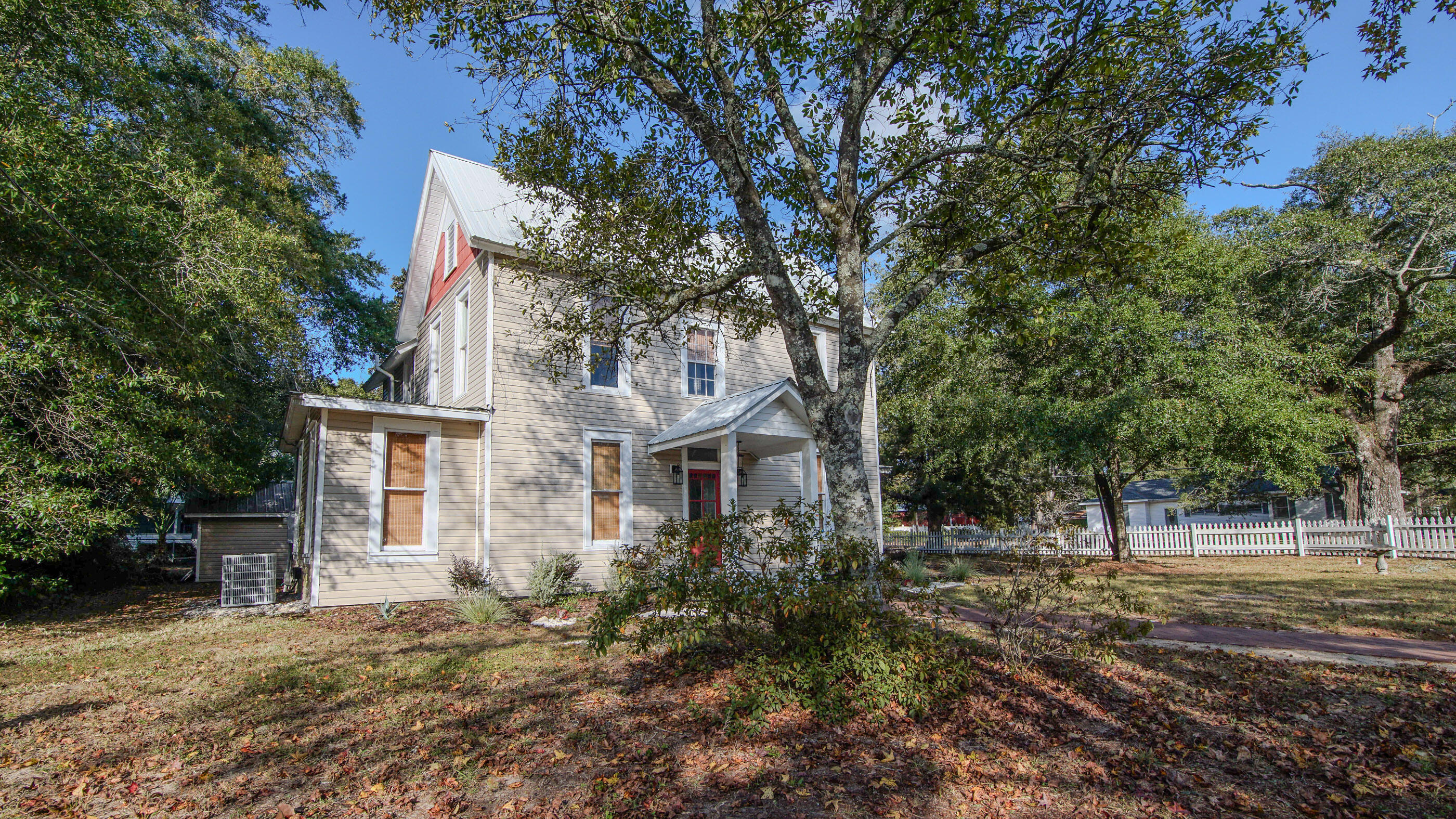 87 Bay Avenue DeFuniak Springs, FL 32435 - Photo 55 of 55 a front view of a house with a tree