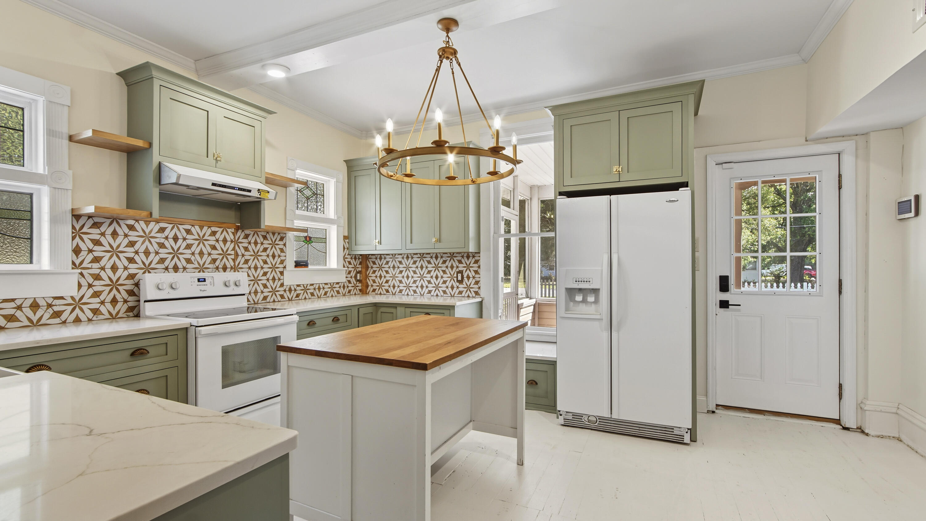 87 Bay Avenue DeFuniak Springs, FL 32435 - Photo 6 of 55 a kitchen with stainless steel appliances granite countertop a sink stove and refrigerator