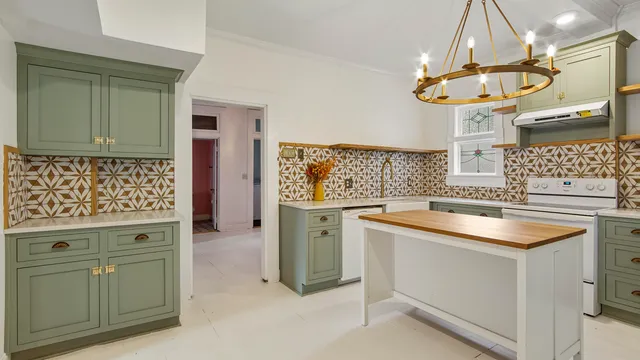 a kitchen with a sink stove and cabinets