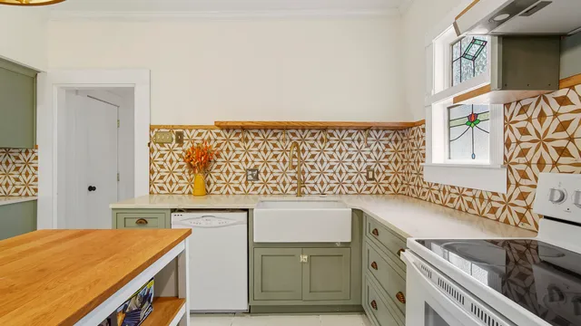 a view of a kitchen with a sink and dishwasher