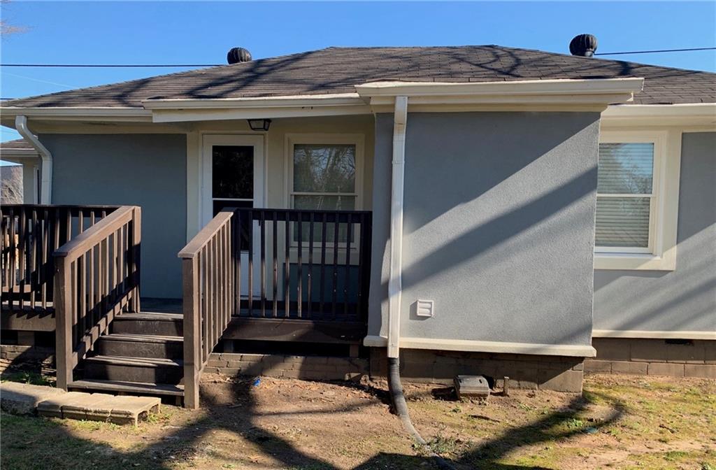 1261 Concord Road Southeast Smyrna, GA 30080 - Photo 26 of 50 a view of a house with wooden deck