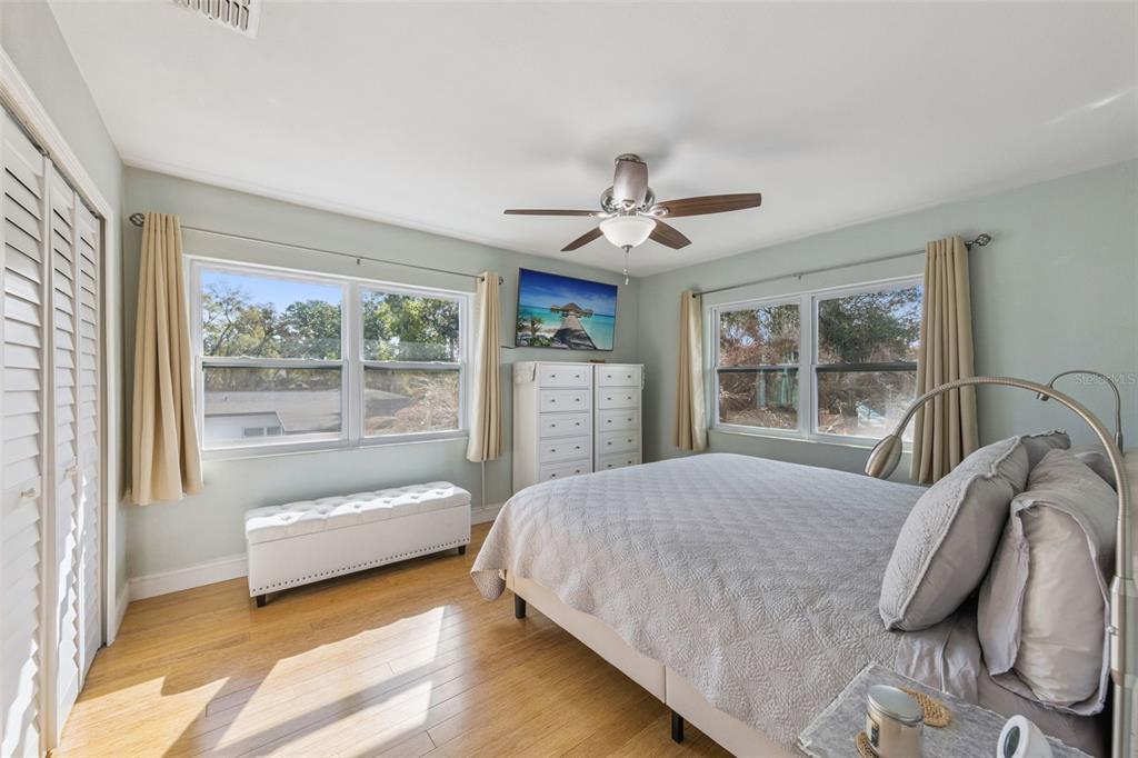 124 East Harding Street Orlando, FL 32806 - Photo 13 of 21 a bedroom with a large bed and a large window