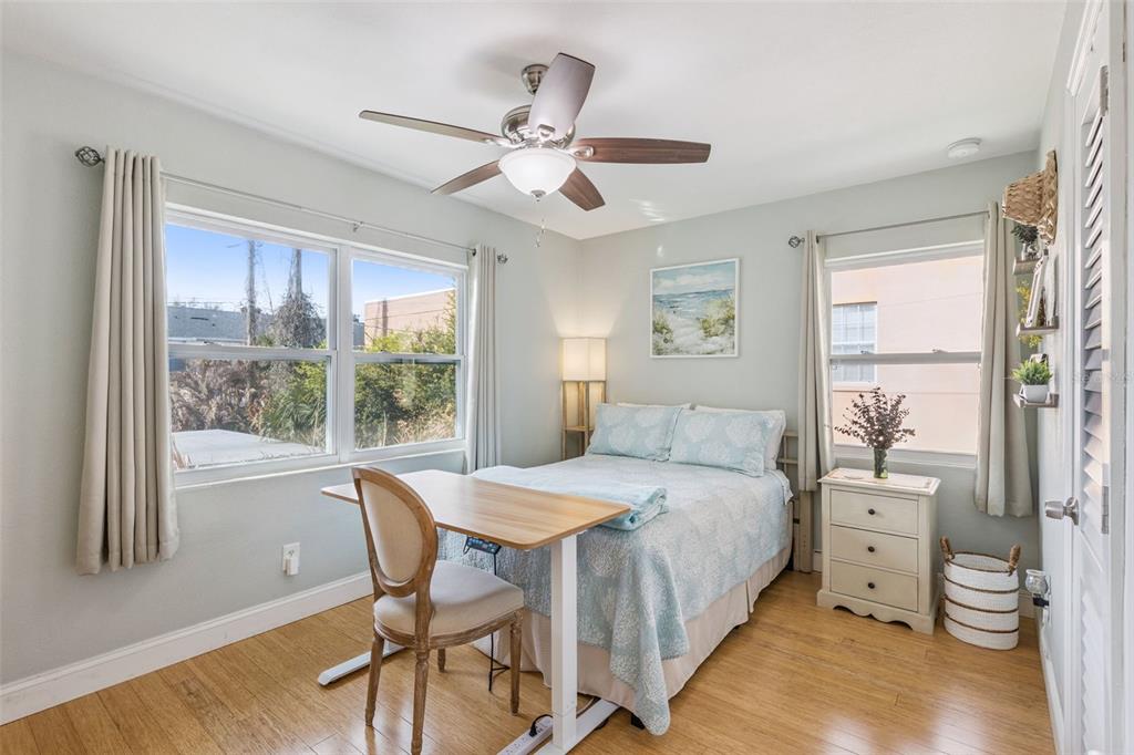 124 East Harding Street Orlando, FL 32806 - Photo 14 of 21 a bedroom with a bed and a large window