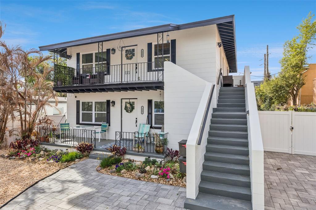 124 East Harding Street Orlando, FL 32806 - Photo 2 of 21 a front view of house along with deck and outdoor seating