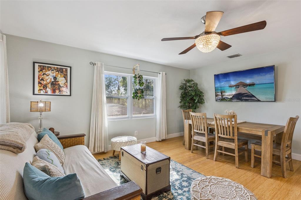 124 East Harding Street Orlando, FL 32806 - Photo 5 of 21 a living room with furniture a desk and chair with wooden floor